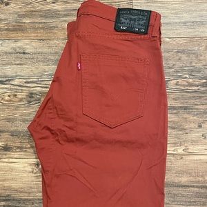 NWOT Red / burnt orange Levi’s 511 jeans size 34 x 29